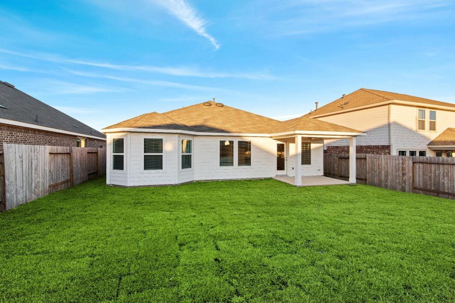 Exterior details and patio area of a home in Magnolia Ridge, Magnolia (Image 3).