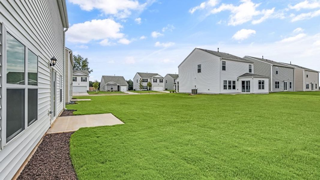 Front exterior of a new home in Wilson's Ridge, Smithfield, NC, highlighting curb appeal (Image 16).