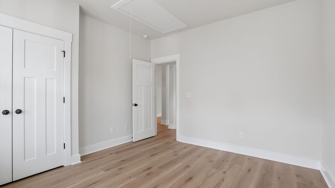 Thoughtfully designed secondary room featuring hardwood flooring and tasteful detail located in Greenville, SC
