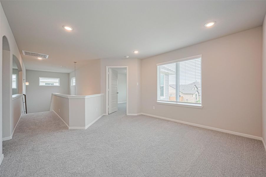 Spacious, unfurnished interior of a new home in Sunterra, Katy (Image 38).