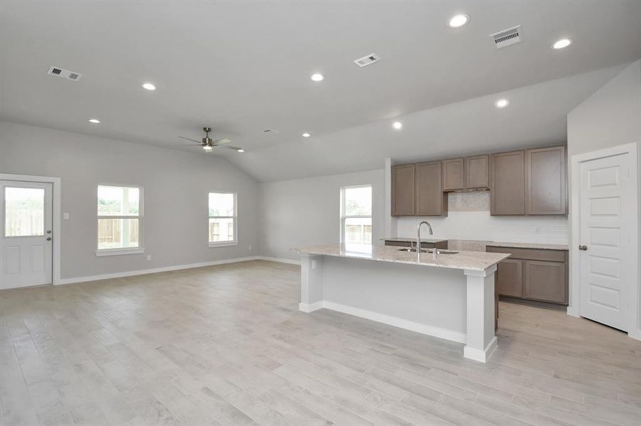 This generously spacious kitchen is a dream realized!  Sample photo of completed home with similar floor plan. Actual colors and selections may vary.