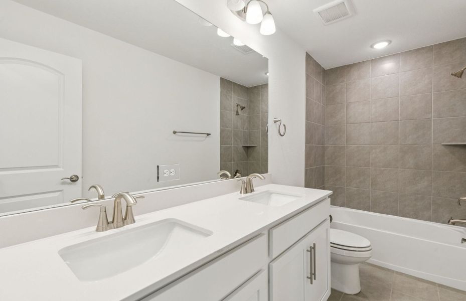 Stylish secondary bath with high-end fixtures  *Real home pictured