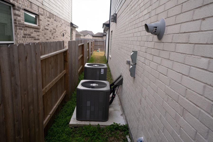 Exterior details and patio area of a home in Sunterra, Katy (Image 4).