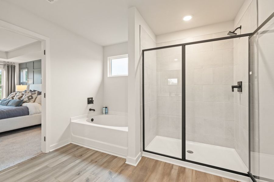 A bathroom with a glass shower.