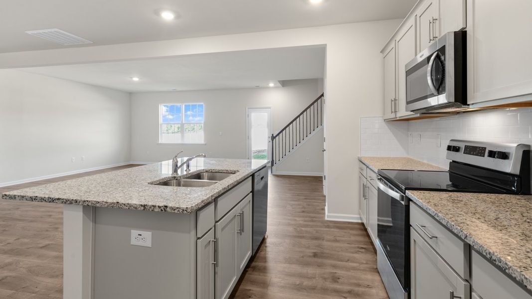 Furnished interior view inside a new home in The Grove at Matthews Landing, Fuquay Varina (Image 5).