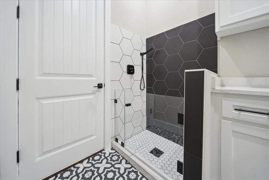 Bathroom featuring a tile shower