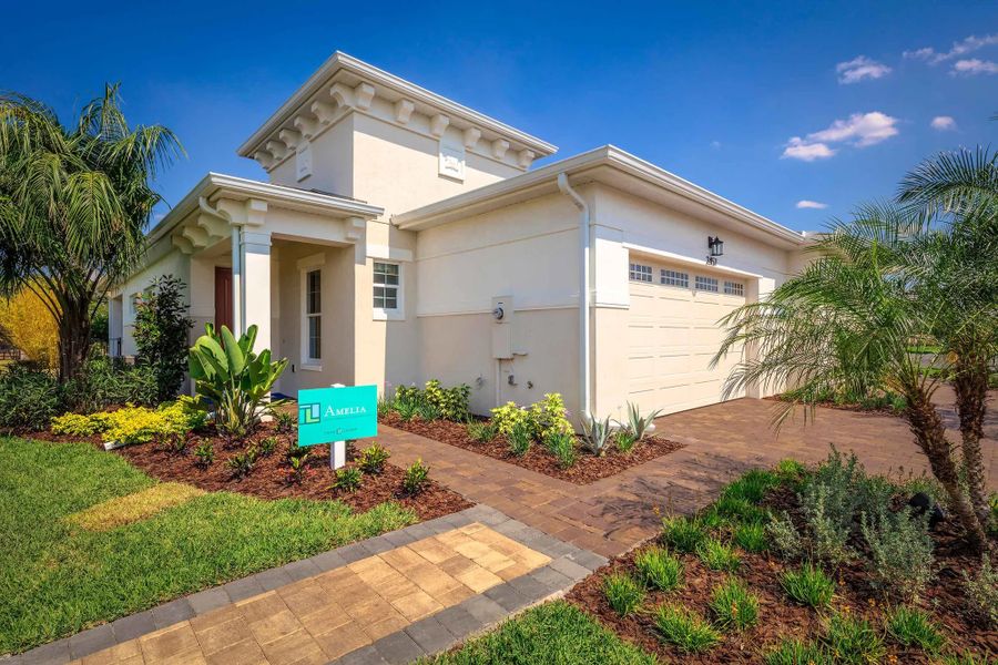Representative exterior photo of a completed home built from the Amelia by Jones Homes USA in Twin Lakes, St. Cloud, FL (Image 7).