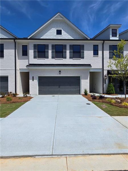 Front exterior of a new home in Magnolia Square, Austell, GA, highlighting curb appeal (Image 1). Front exterior of a new home in Magnolia Square, Austell, GA, highlighting curb appeal (Image 1).