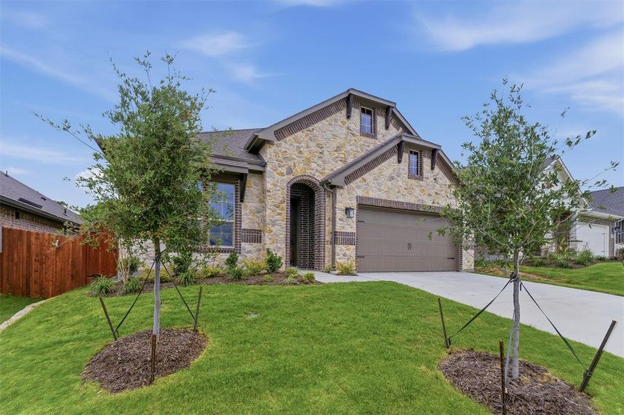 Stone and brick exterior with an arched entryway