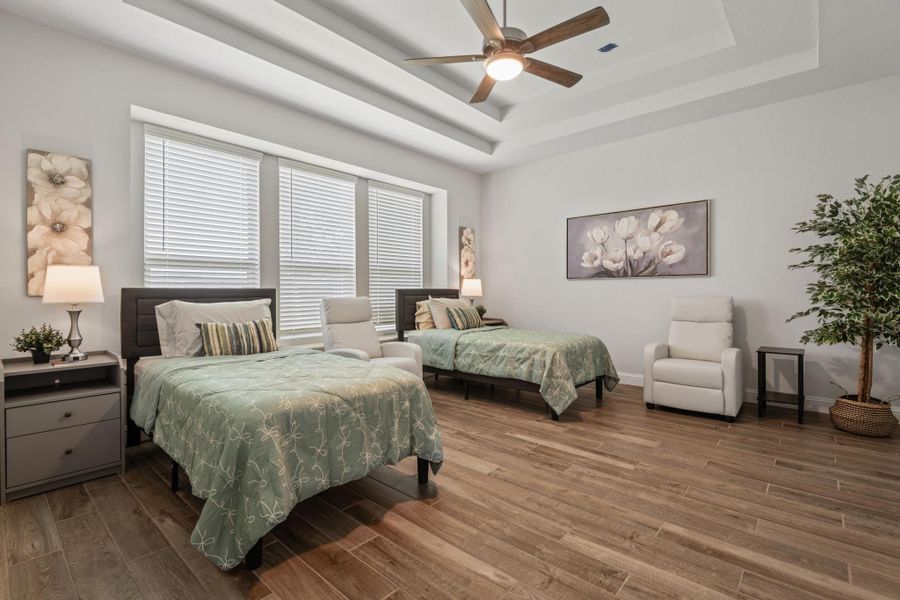 This spacious shared bedroom features two twin beds with modern, neutral decor and hardwood flooring. Large windows provide ample natural light, complemented by elegant lighting fixtures. The room includes a cozy seating area and tasteful artwork, creating a welcoming and serene atmosphere. This spacious shared bedroom features two twin beds with modern, neutral decor and hardwood flooring. Large windows provide ample natural light, complemented by elegant lighting fixtures. The room includes a cozy seating area and tasteful artwork, creating a welcoming and serene atmosphere.