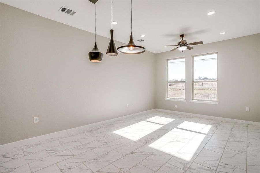 Spare room featuring ceiling fan