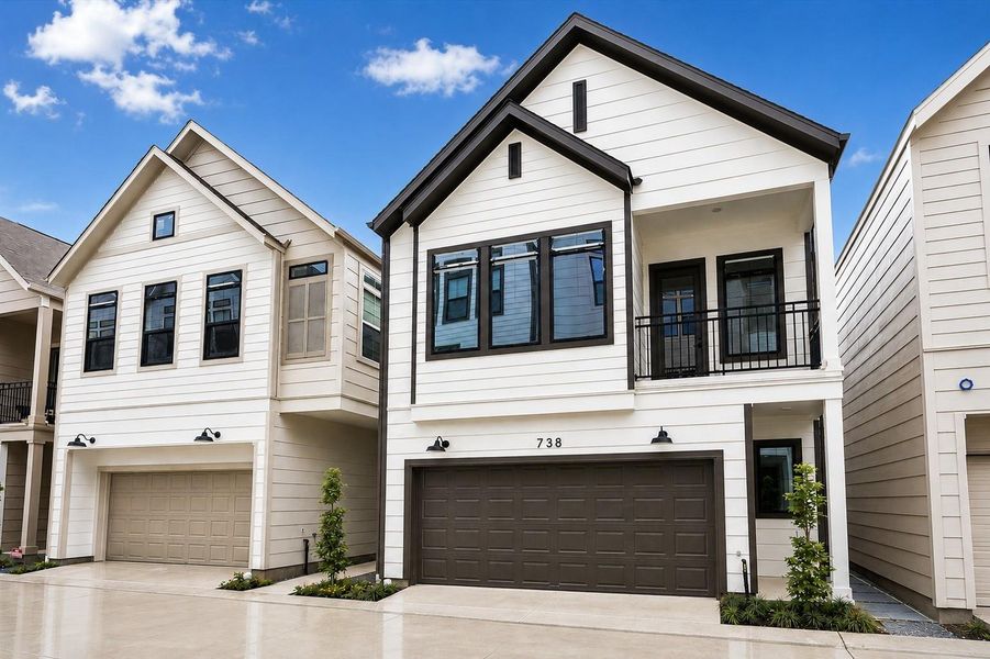 Fresh modern farmhouse "Amanda" plan with private covered patio in a boutique gated community.