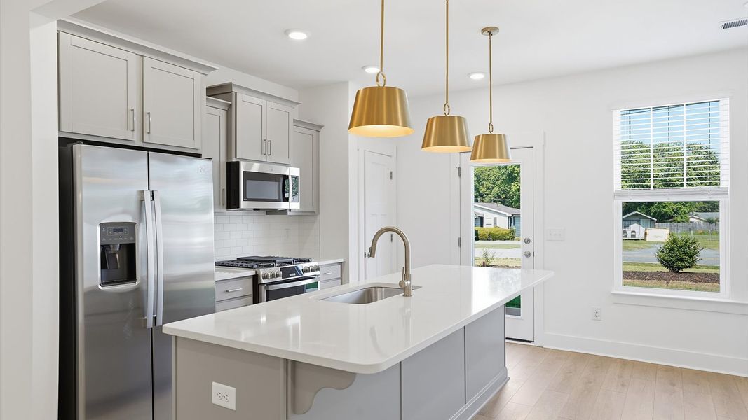 Well-designed kitchen with a center island and tasteful finishes that elevate everyday living at Saluda Crossing