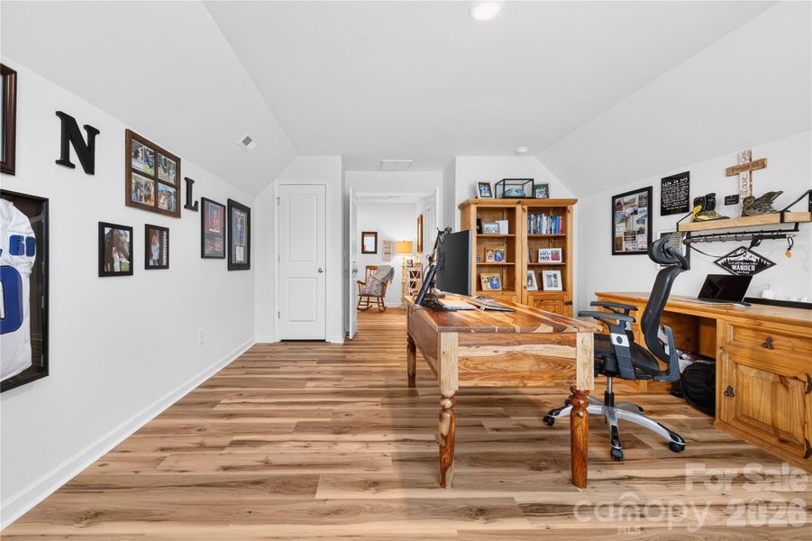 The bonus room is at the end of the hallway providing a buffer from the rest of the home.