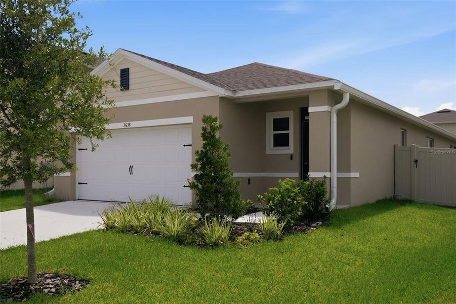Front exterior of a new home in Concorde, Sanford, FL, highlighting curb appeal (Image 2). Front exterior of a new home in Concorde, Sanford, FL, highlighting curb appeal (Image 2).
