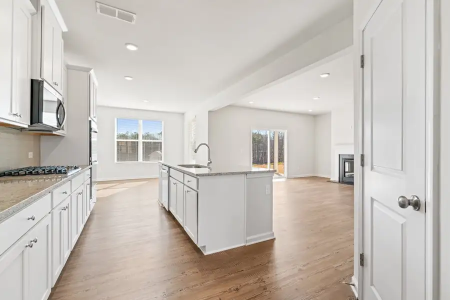 A kitchen with white cabinets. A kitchen with white cabinets.