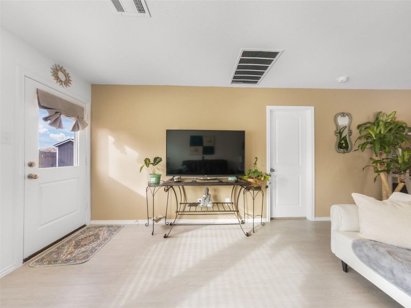 Foyer with wood finished floors