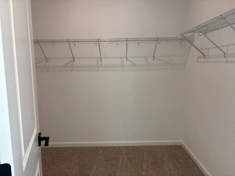 Primary Walk-In featuring the AW Collection® Foundry - Clean layout with refined simplicity.