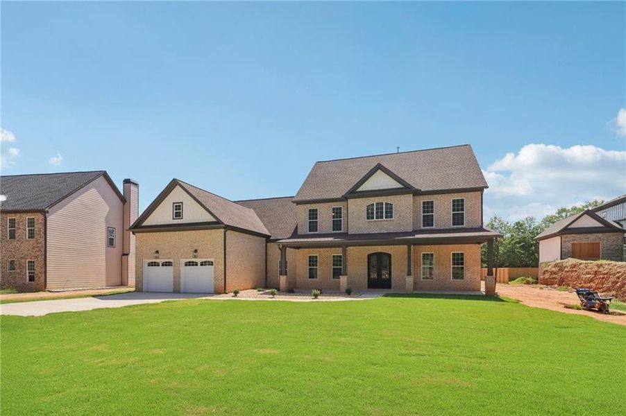 Front exterior of a new home in , Lilburn, GA, highlighting curb appeal (Image 35).