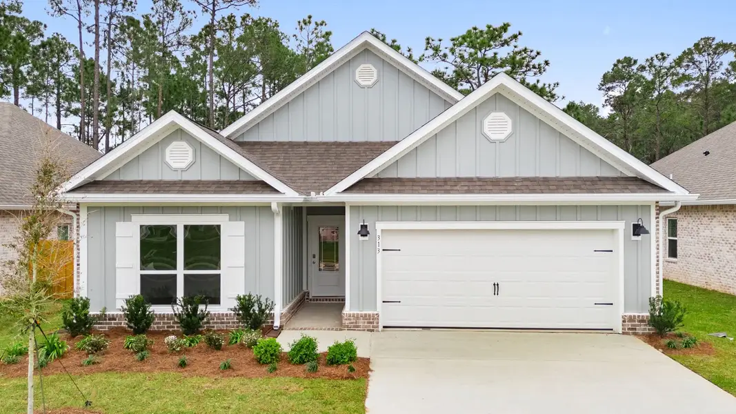 Front exterior of a new home in Holley Grove at Peach Creek, Santa Rosa Beach, FL, highlighting curb appeal (Image 1). Front exterior of a new home in Holley Grove at Peach Creek, Santa Rosa Beach, FL, highlighting curb appeal (Image 1).
