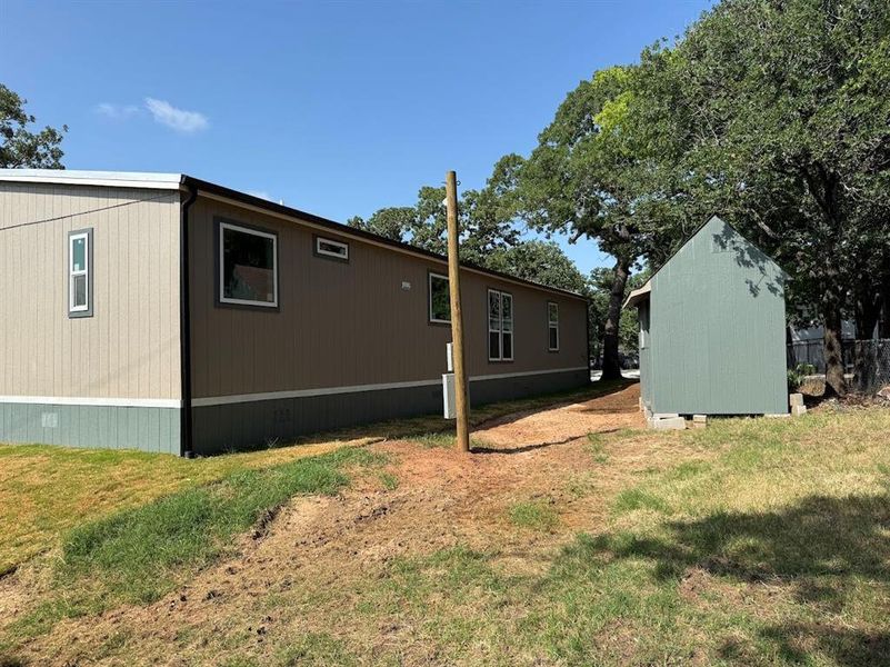 Exterior details and patio area of a home in , Pelican Bay (Image 14).