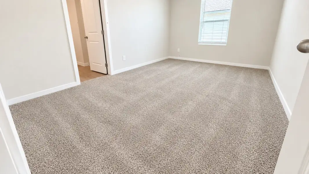Spacious, unfurnished interior of a new home in Flagstop Crossing, Odem (Image 17).