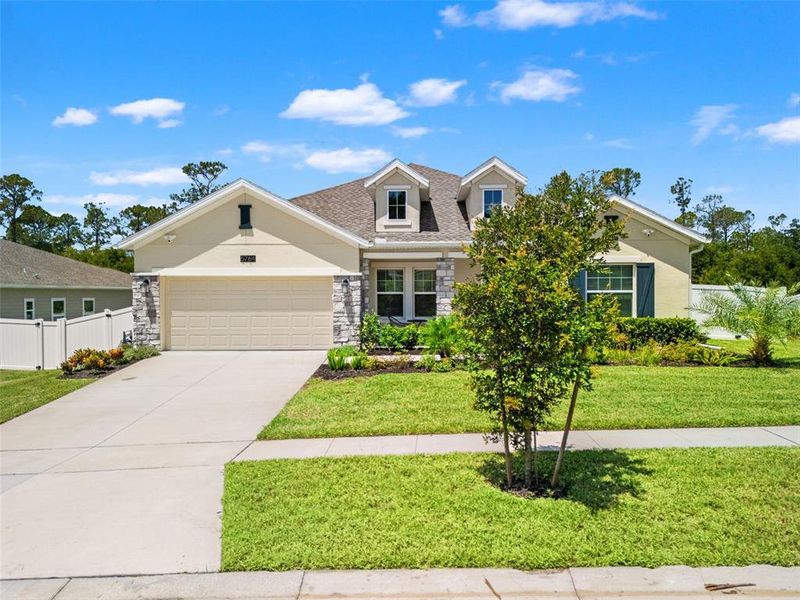 Front exterior of a new home in , Mount Dora, FL, highlighting curb appeal (Image 25). Front exterior of a new home in , Mount Dora, FL, highlighting curb appeal (Image 25).