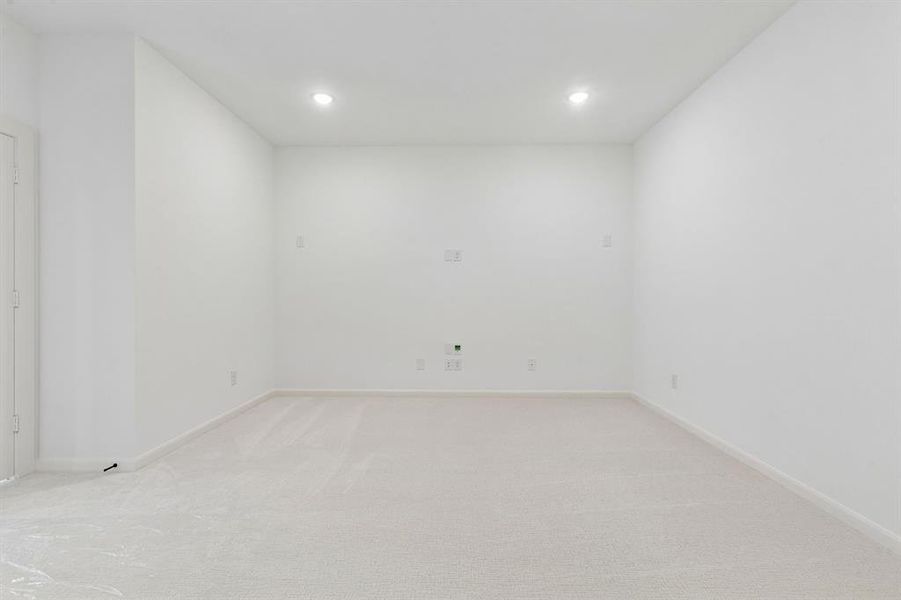 This spacious media room paired with adjacent game room create the ultimate family entertainment zone!