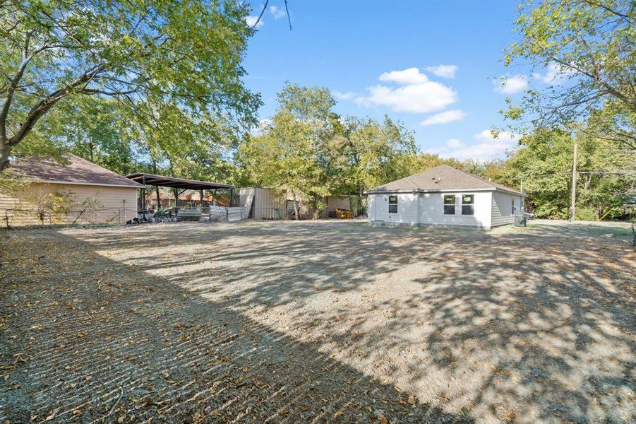 Rear view of house with a carport