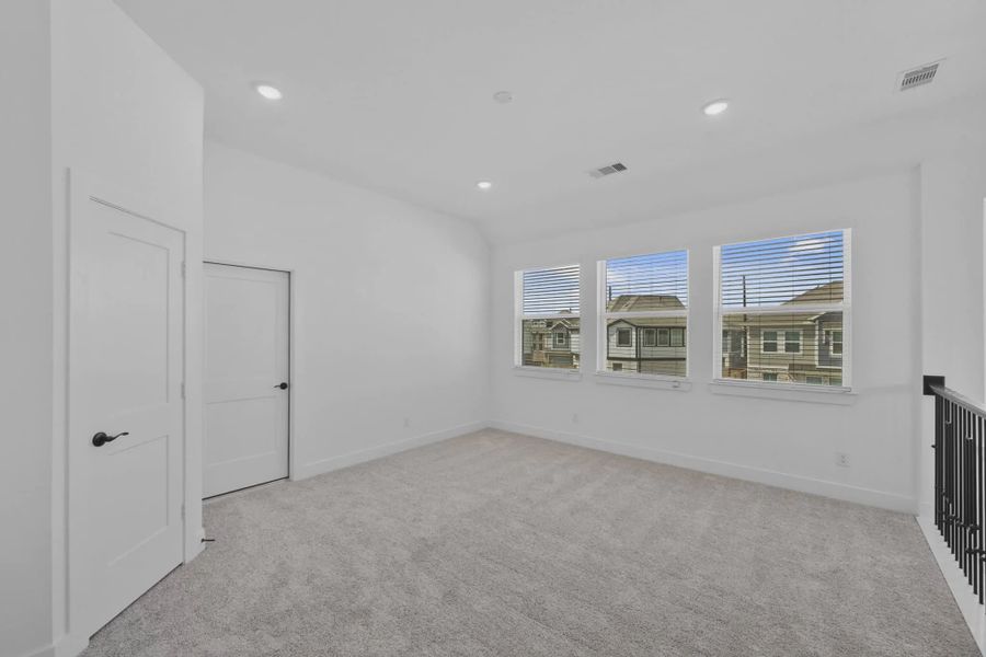 Representative unfurnished interior of a home built from the Versailles by Chesmar Homes in Meridiana Chateau, Manvel (Image 44).
