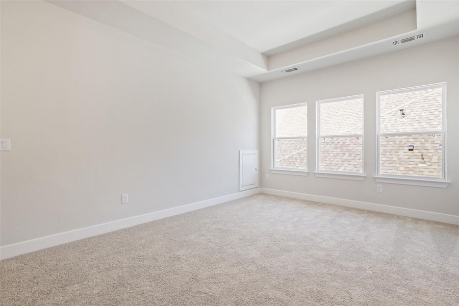 Spare room with carpet and baseboards Spare room with carpet and baseboards