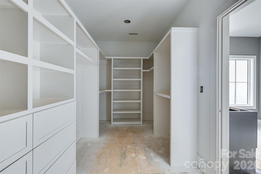 Primary Closet with custom built-ins- solid wood