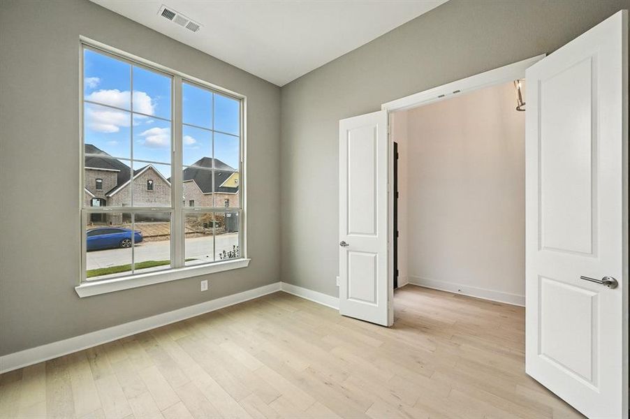 Spacious, unfurnished interior of a new home in Wildflower Ranch: Artisan Series - 60ft. lots, Dish (Image 13).