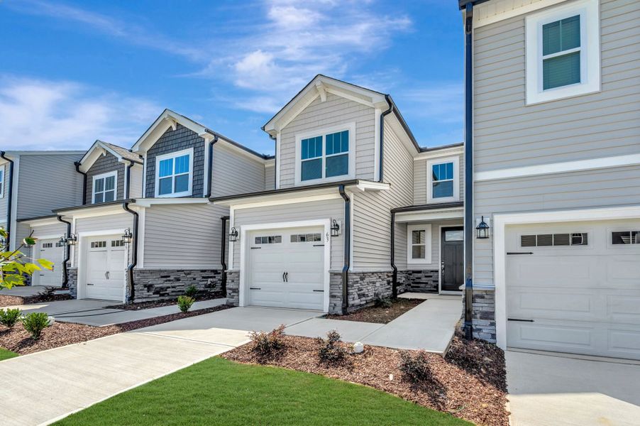 Front exterior of a new home in Powell, Angier, NC, highlighting curb appeal (Image 1). Front exterior of a new home in Powell, Angier, NC, highlighting curb appeal (Image 1).