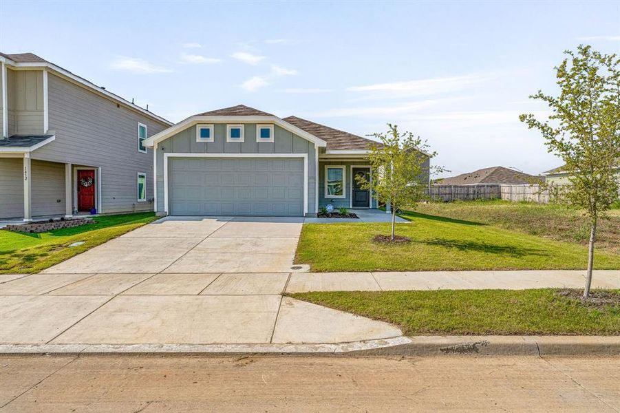 Front exterior of a new home in South Oak Grove: Cottage Collection, Fort Worth, TX, highlighting curb appeal (Image 18). Front exterior of a new home in South Oak Grove: Cottage Collection, Fort Worth, TX, highlighting curb appeal (Image 18).