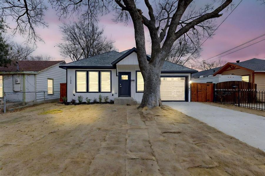 View of front of property with a garage