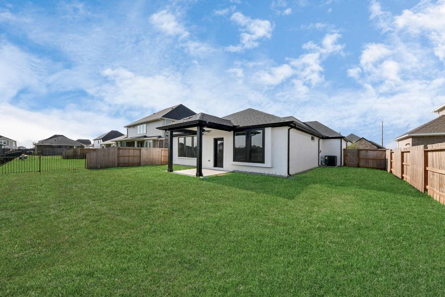Exterior details and patio area of a home in Arabella on the Prairie: Premier Collection, Richmond (Image 4). Exterior details and patio area of a home in Arabella on the Prairie: Premier Collection, Richmond (Image 4).