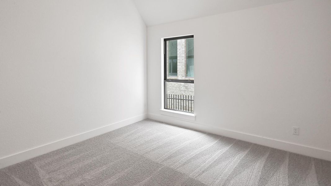 Kitchen with a sink, wood finished floors, decorative backsplash, and vaulted ceiling