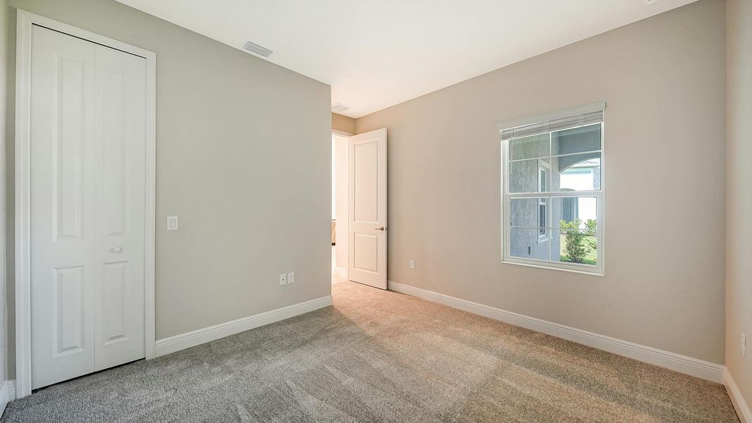 Spacious, unfurnished interior of a new home in Wildleaf Real Estate and Homes for Sale in Parrish, FL - Neal Communities, Parrish (Image 33).