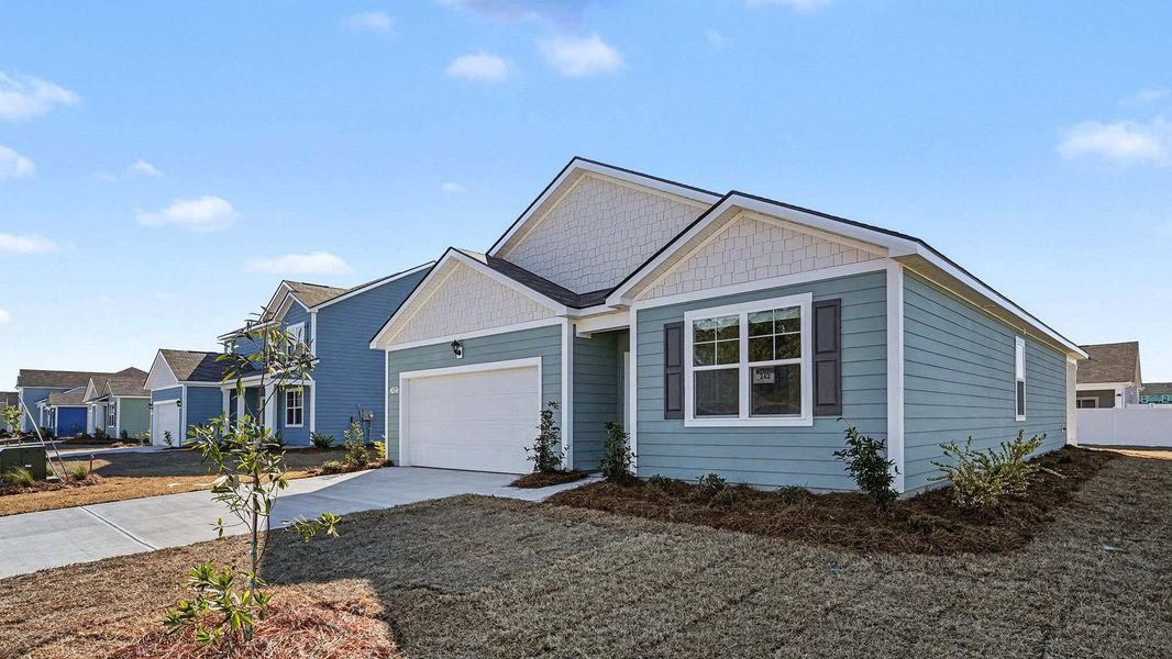 Front exterior of a new home in Sandridge Park, Little River, SC, highlighting curb appeal (Image 18).
