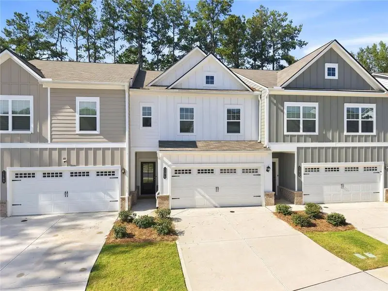 Front exterior of a new home in , Sugar Hill, GA, highlighting curb appeal (Image 1). Front exterior of a new home in , Sugar Hill, GA, highlighting curb appeal (Image 1).