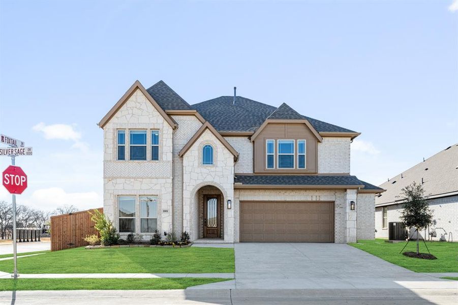 Front exterior of a new home in Timberbrook, Justin, TX, highlighting curb appeal (Image 2).