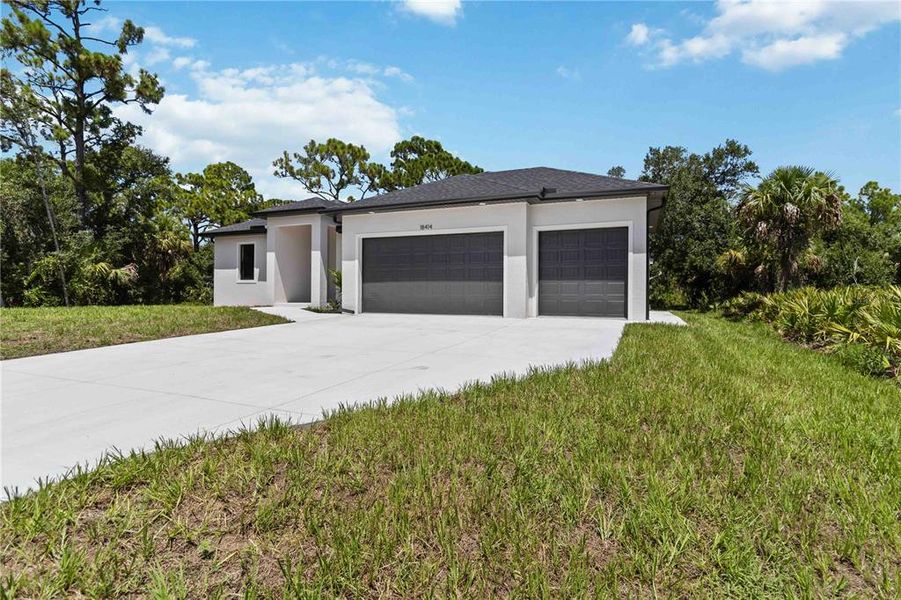 Front exterior of a new home in , Port Charlotte, FL, highlighting curb appeal (Image 2).