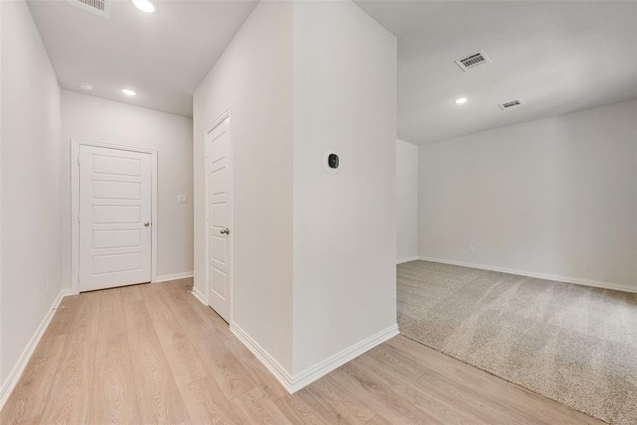 Corridor featuring light hardwood / wood-style flooring