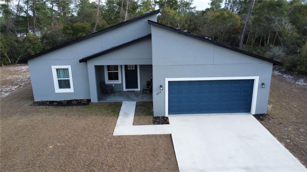 Front exterior of a new home in , Ocala, FL, highlighting curb appeal (Image 29).
