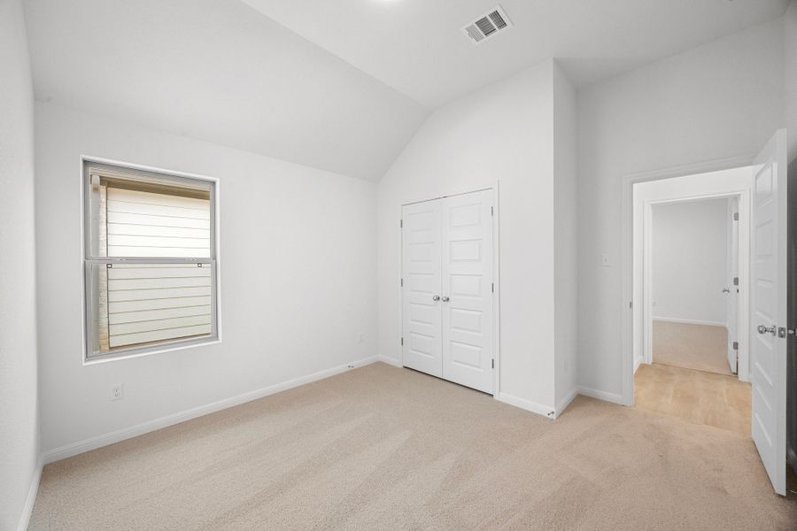 Bedroom in the Cypress home plan by Trophy Signature Homes - REPRESENTATIVE PHOTO