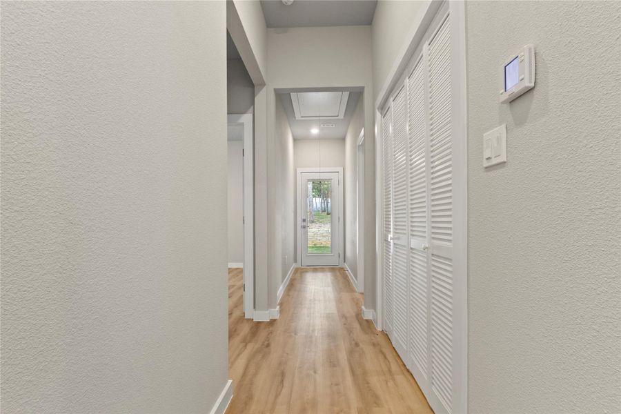 Hall way view leading to a wonderful oversize backyard oasis.