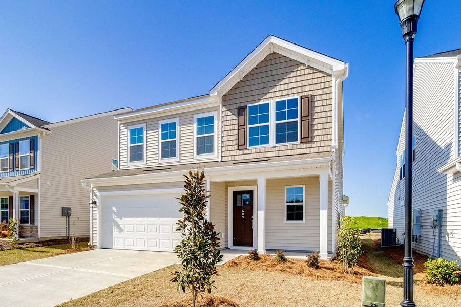 Front exterior of a new home in Winston Point, Gilbert, SC, highlighting curb appeal (Image 18).