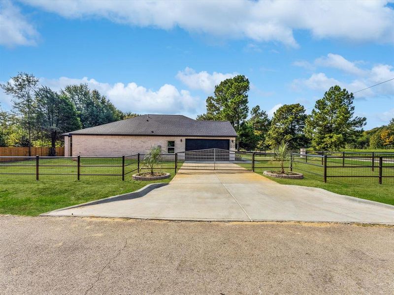 View of front of house featuring driveway and a garage
