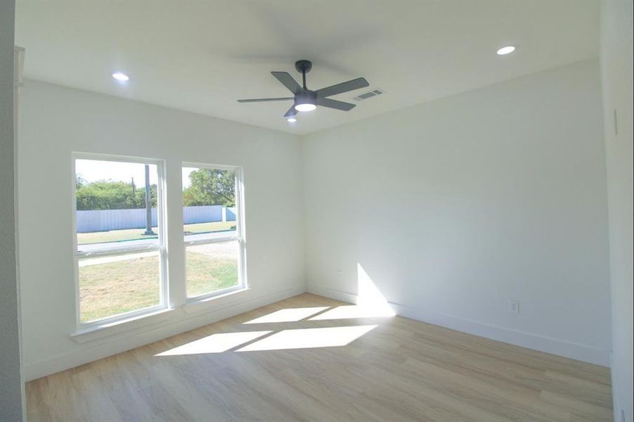 Spare room featuring light wood-style flooring, recessed lighting, and ceiling fan Spare room featuring light wood-style flooring, recessed lighting, and ceiling fan